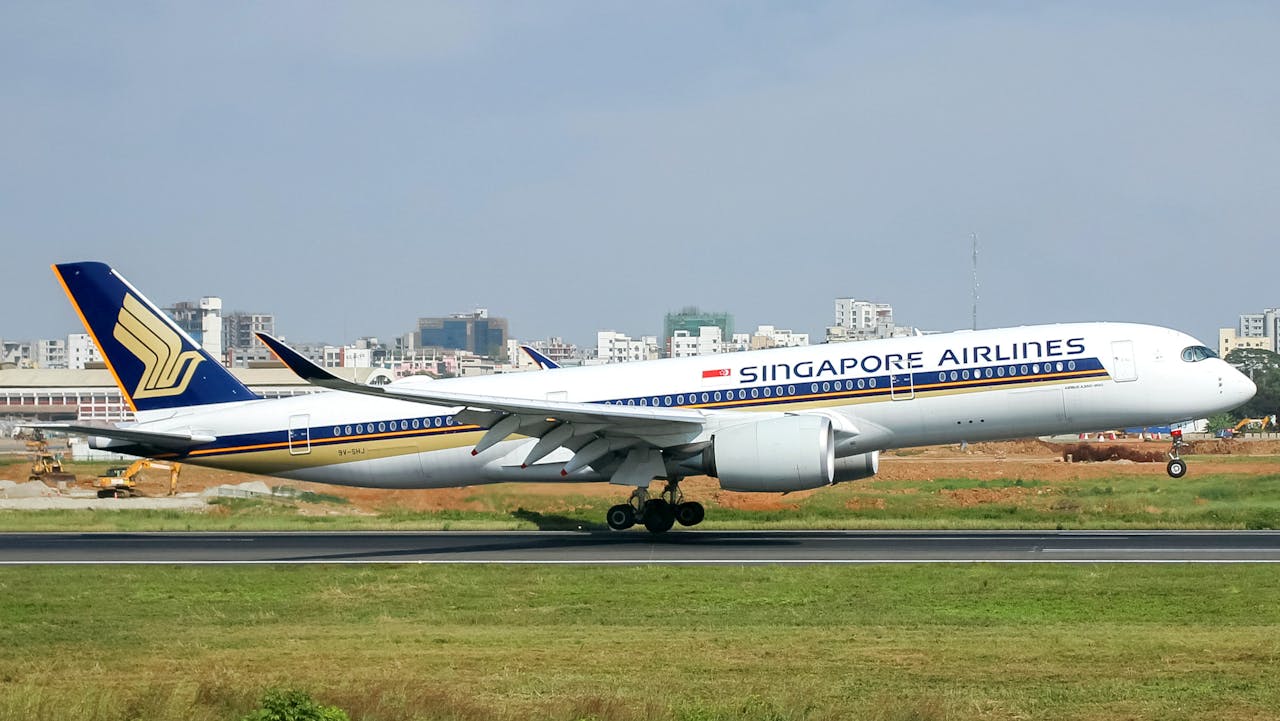 White and Blue Passenger Plane on Runway